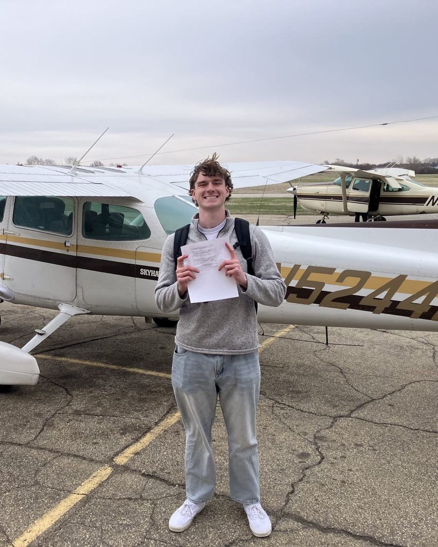 Matthew Ewing, founder of Stratum Systems, standing on the ramp in front of a Cessna 172 Skyhawk.